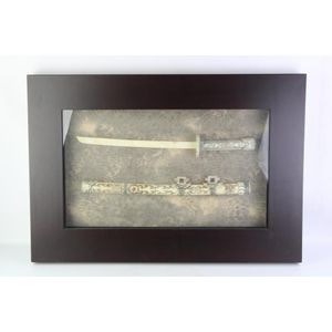 Framed diorama of bone sword carved and assembled from several…
