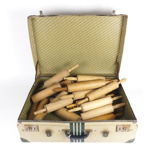A collection of vintage rolling pins, various sizes, one or two…