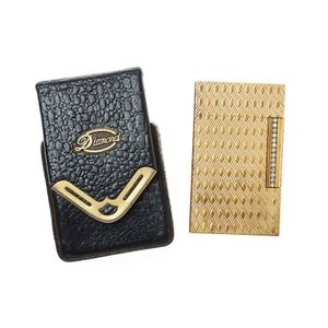 A vintage Dupont diamond series lighter, gold plated engine…