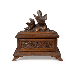A carved Continental pine jewel box, early 20th century,…