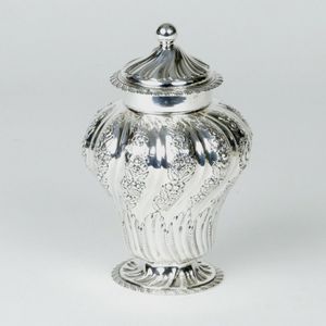 A Victorian silver tea caddy, of baluster shape with embossed…