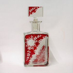 A Bohemian cut glass and red flashed spirit's decanter, the…