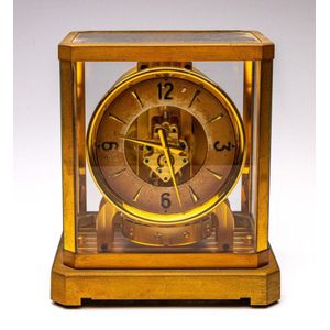 A Atmos Jager-Le Coultre gilt clock in glass casing, height 24 ...