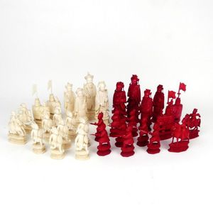 Chess pieces: 32 red and white ivory pieces without board., Complete number  of pieces of a chess game. Sixteen cut ivory pieces that have been made red  with a dyestuff: these are