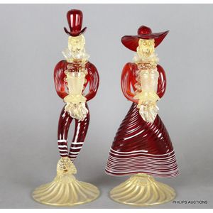 A pair of red Venetian glass figural candlesticks, second half…