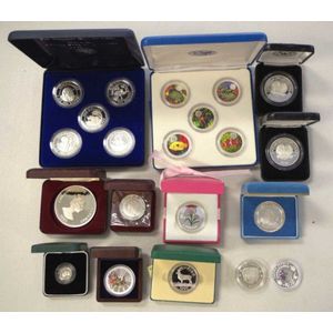 Twenty one world silver coins including 1996 Zimbabwe $10 set,…