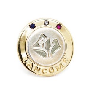 Silver and gold Lancome badge By Tiffany & Co marked 18k on…