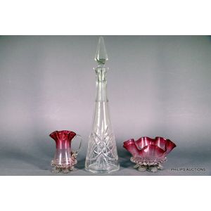 A cranberry glass bowl with matching jug, and a cut glass…