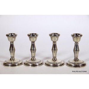 A set of four short sterling silver candlesticks, 1985 and 1992…