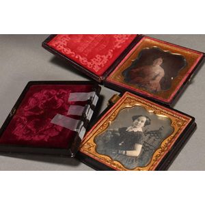 Pair of 19th century daguerreotypes and cases, depicting three…