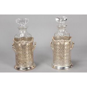 Pair of English silver plate and glass decanters, of facetted…