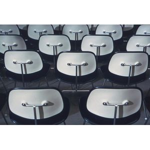 Five photographs depicting Eames chairs by Charles Eames,…