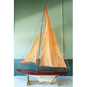 An early 20th century wood racing pond yacht, white painted…