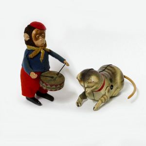 A Schuco clockwork monkey drummer, and a German tinplate cat…