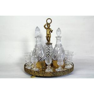 A liquor set, c.1830-1840, comprising: three cut crystal…
