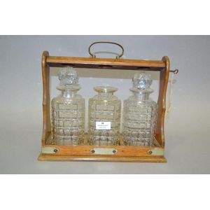 Tantalus (one decanter missing stopper), approx 33 cm high, 33…