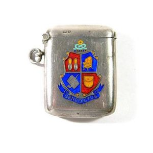 A sterling silver vesta case, hallmarked Chester 1905 with an…