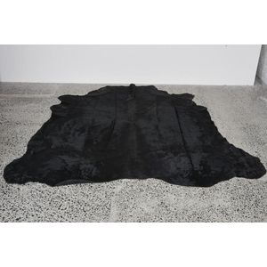 Black cow hide rug, 20th century, 214 x 212 cm. Provenance: The…