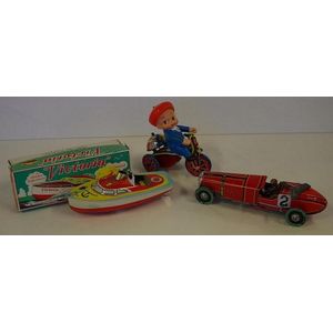 Three vintage wind up tin toys comprising of a boxed boat,…