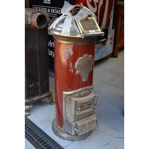 Cyclop cylinder form stove, with iron red cylinder body approx.…
