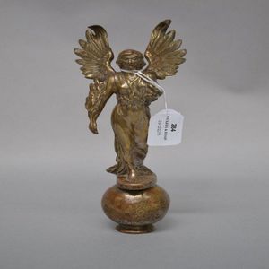 An early 20th century nickel plated brass car mascot, figural…