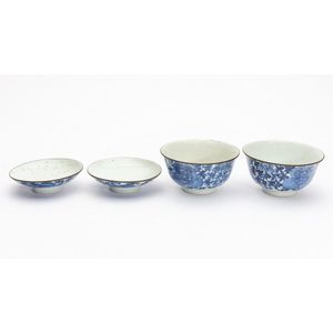 A pair of Japanese blue and white lidded bowls with peony…