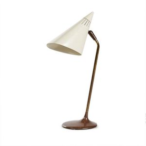 A modernist table lamp by Lightolier, with a white enamelled…