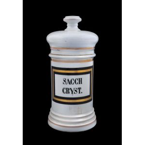 An antique ceramic apothecary jar labelled, Sacch Cryst. 19th…