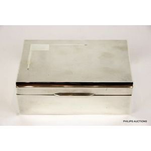 An English sterling silver cigarette box, 1940 Sheffield, with…