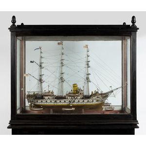 A large cased scale model of the ship hallmarked sterling…