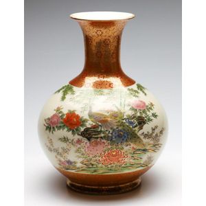 A Japanese Satsuma crackle glaze vase featuring peacocks,…