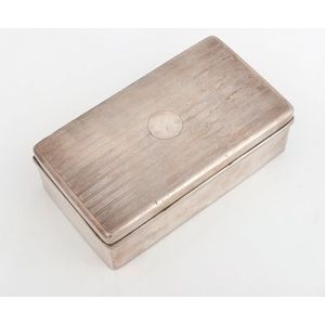 A silver cigarette box with cedar lining, circa 1920, 5 cm high,…