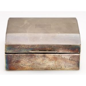 A hallmarked sterling silver cigarette box, inscribed with…