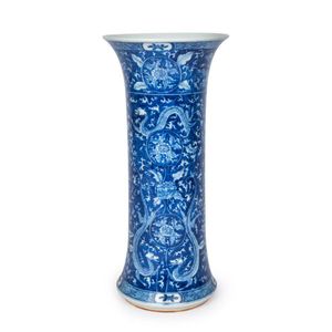 A Chinese blue and white cylindrical porcelain vase with flared…