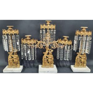 An early 19th century French three piece girandole garniture,…