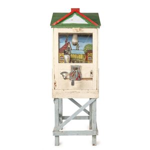 An old painted wooden house pistol shooting arcade game. Glass…
