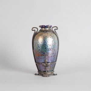 A Loetz Art Nouveau iridescent glass vase in a pewter mount,…