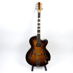 A Hofner electric guitar with soft case, strap and stand. With…