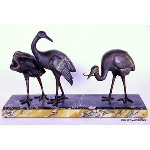 An Art Deco spelter animalier group of three Storks by Irenee…