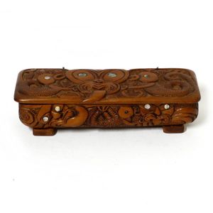 A Jane Brenkley New Zealand Folk Art trinket box, carved with…