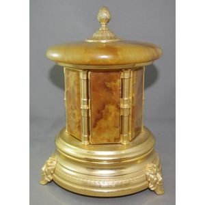 Musical Cigarette dispenser with gilt base and alabaster doors…