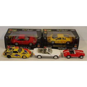 Four die cast model cars including Burago Porsche 911 made in…