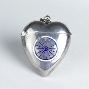 A late Victorian silver heart form and enamel vesta, the front…