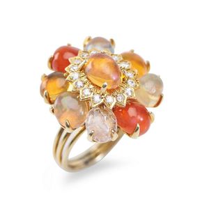 A Mexican fire opal and diamond ring, of large cluster form,…