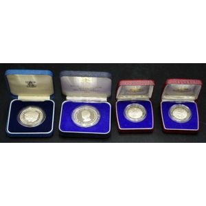 Four commemorative silver proof coins comprising of a 1982…