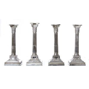 Set of four Stirling silver Corinthian column candlesticks, the…