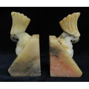 A pair of carved cockatoo marble bookends, height 14 cm