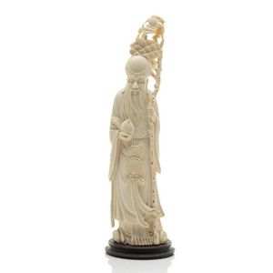 An antique carved ivory figure of Shou Lao, height 31 cm