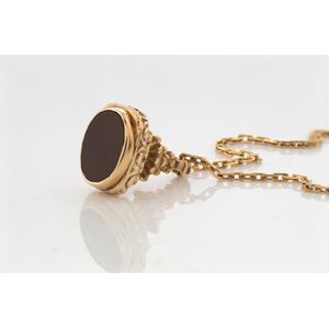 A rolled gold carnelian seal and gold chain, chased decoration&hellip;