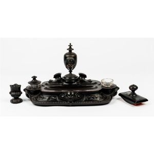 A carved ebonised hardwood and bronze inkstand, English 19th…